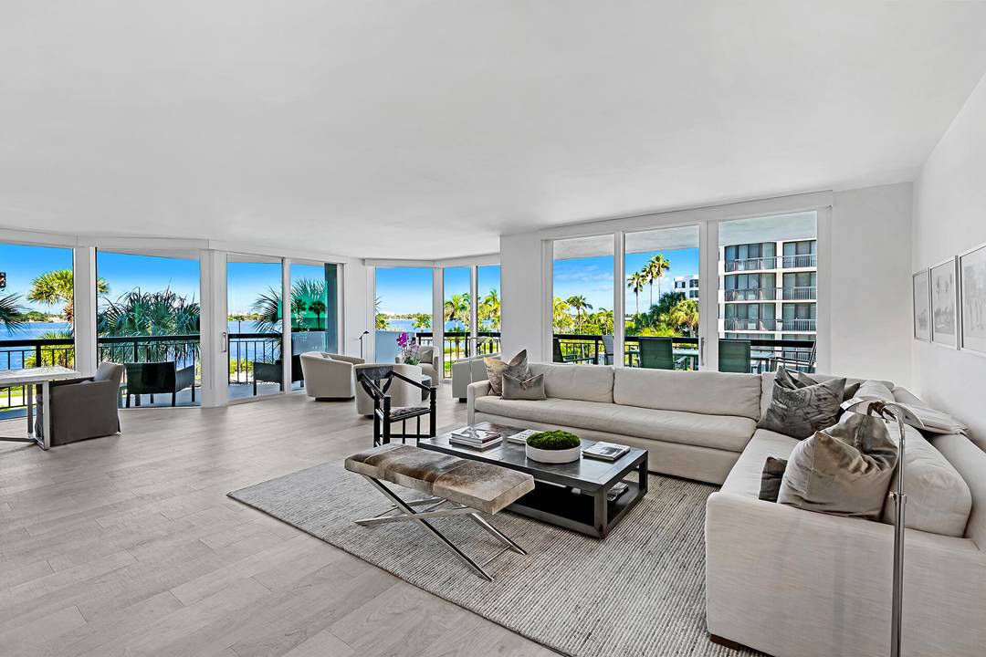 Enjoy water views and magical sunsets from every room of this immaculate unit in the prestigious Carlton Place just a few steps from the Four Seasons Hotel in Palm Beach.