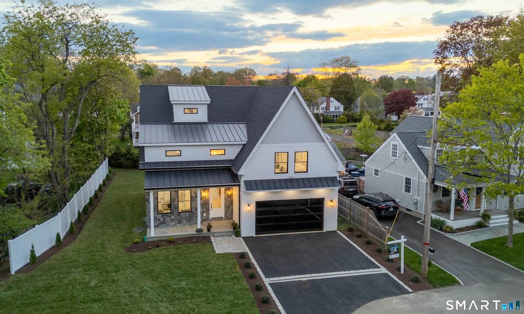 Nestled at the end of a peaceful cul de sac on a level lot, this exceptional 5, 000 Square foot, 5 bedroom, 5.