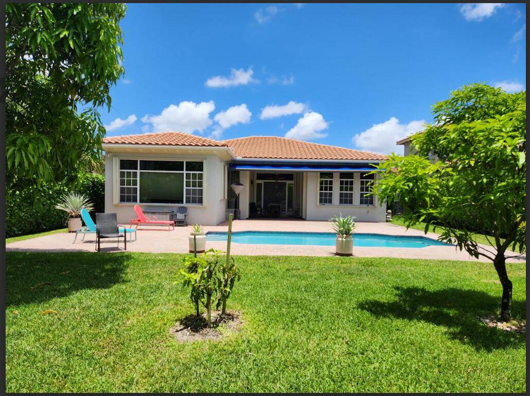 COMPETITIVELY PRICED single story home located within the prestigious gates of HERON BAY.