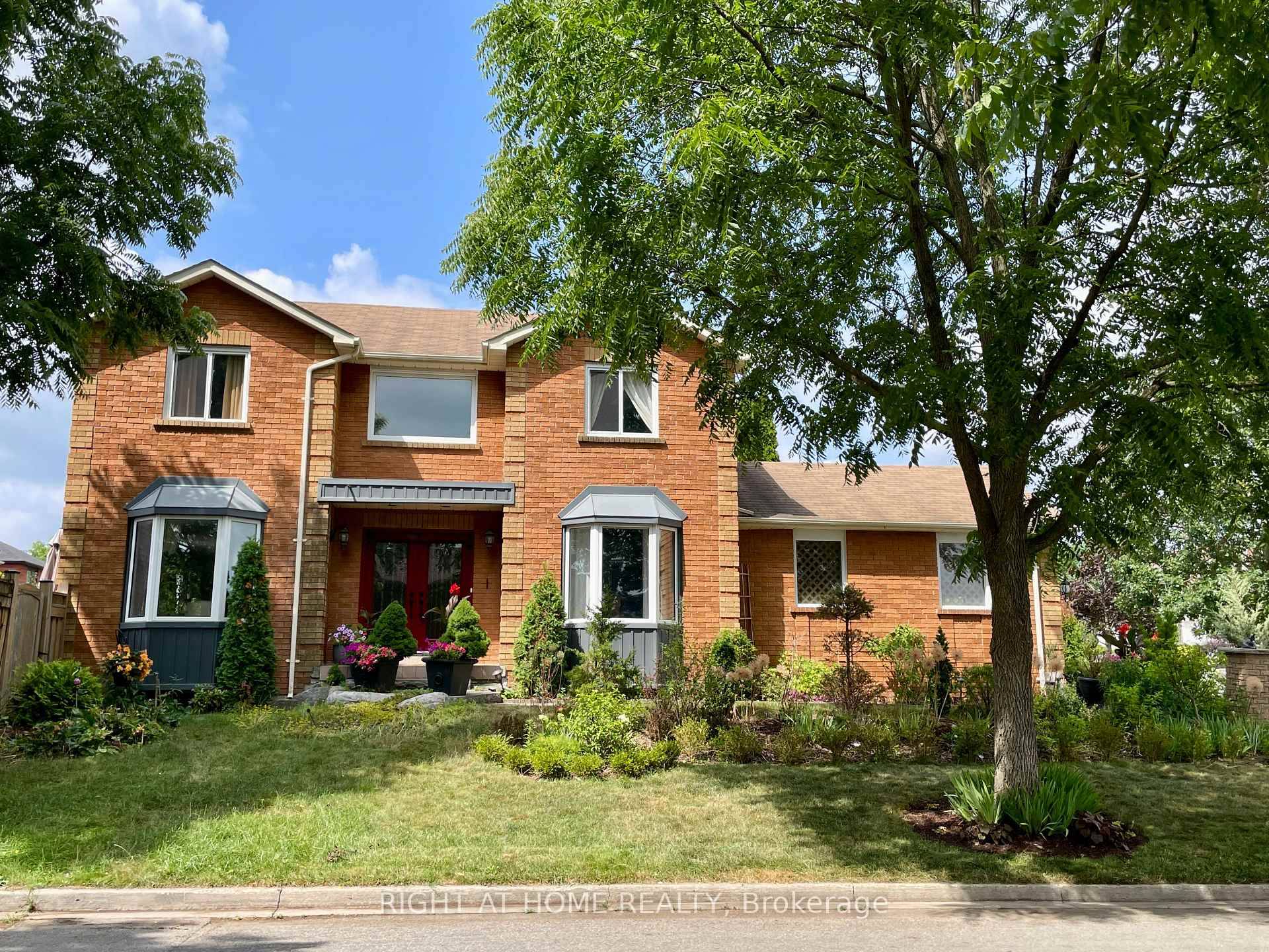 Nestled on a prime corner lot, this home boasts a special blend of privacy and unparalleled curb appeal with no sidewalk in front of the house to spoil the view.