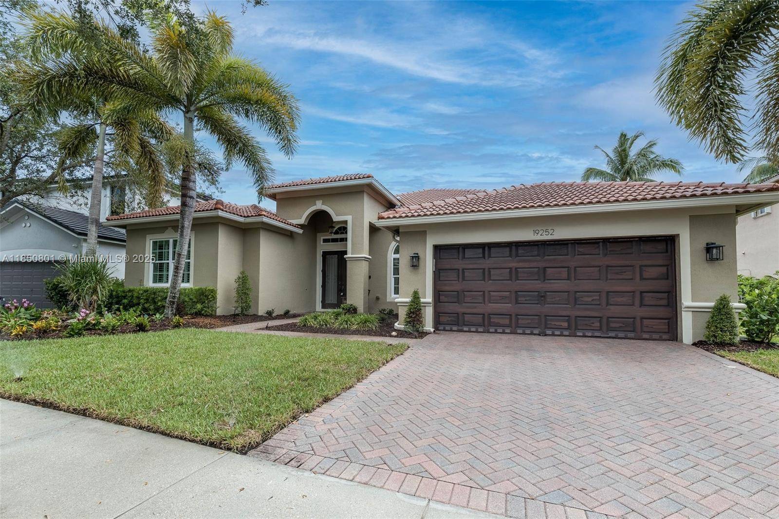 Step into this beautifully transformed lakefront and pool home in the sought after Isles of Weston.