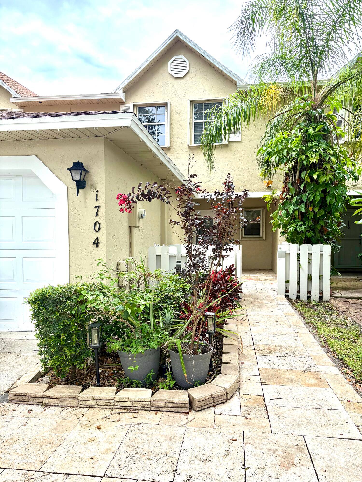 Don't miss this spacious, centrally located Townhome, near shopping, restaurants and Okeeheelee Park !