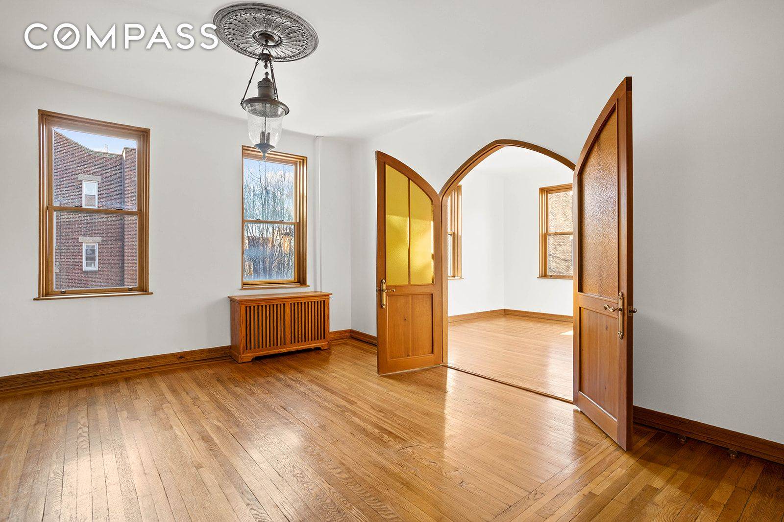 Sunny, open sky outlooks and fine architectural details run throughout this lovely one bedroom, one bathroom home at The Hampton Court, one of Jackson Heights' most celebrated garden cooperatives.