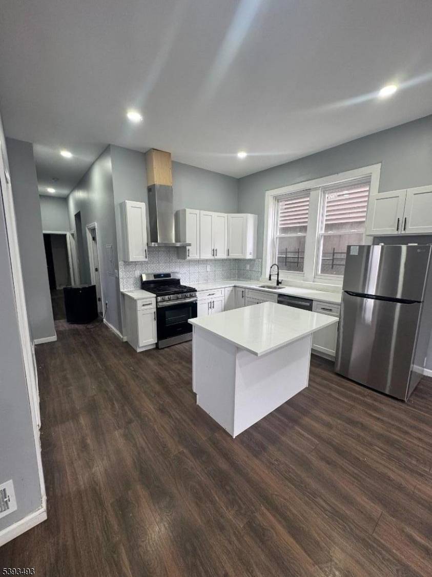 2 family solid brick. 3 bedrooms unit 1 and 3 bedrooms unit 2.