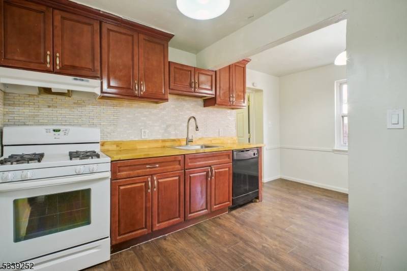 Welcome to Hillside ! This beautiful home is nestled on a tree lined street in a peaceful neighborhood.