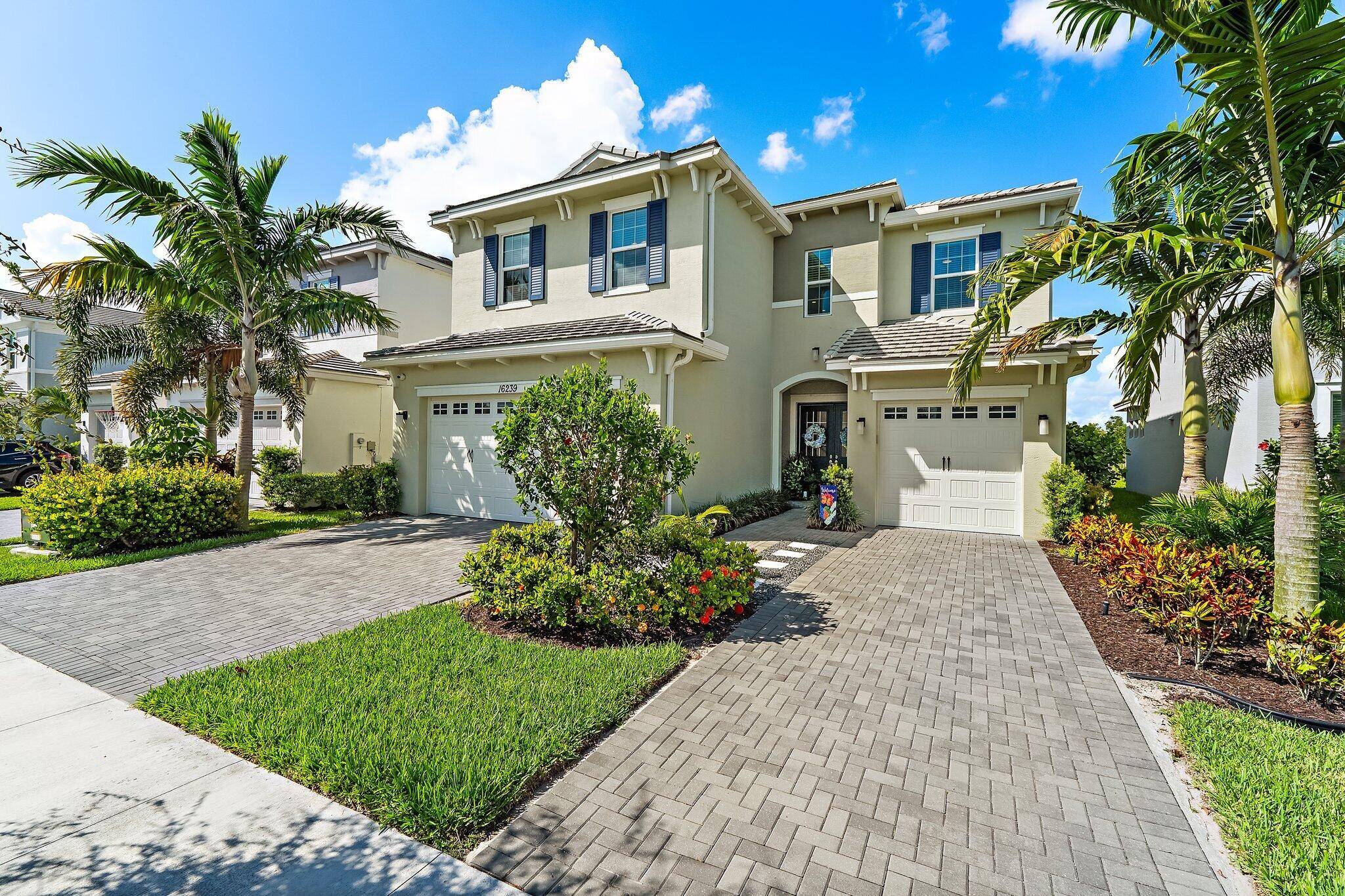 LUXURY POOL HOME IN THE GROVES AT WESTLAKE Discover your dream lifestyle in this stunning waterfront pool home nestled within the gated community of The Groves at Westlake.