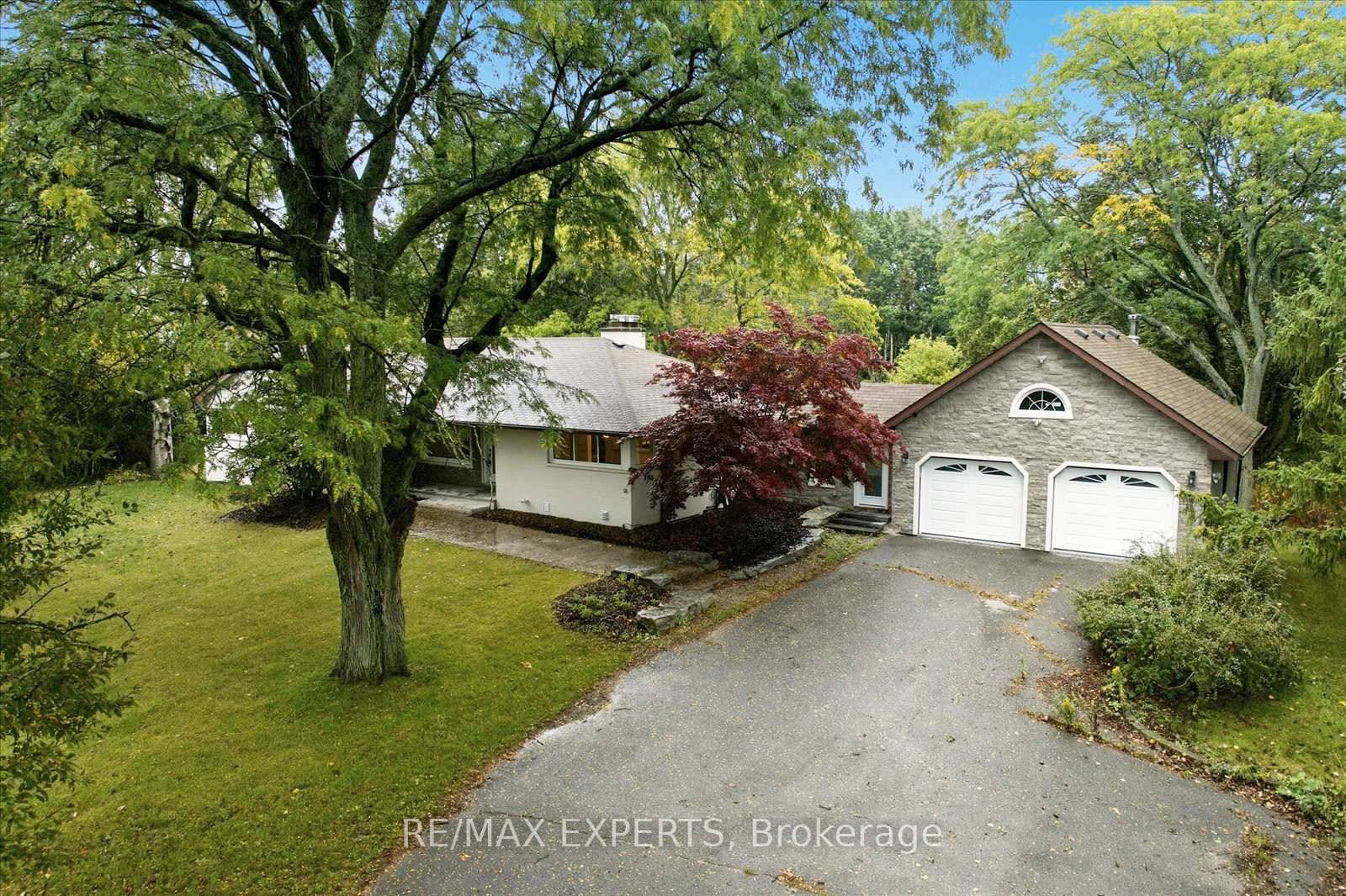 Ideal setting for a client requiring parking or separate space to run a home business in the finished walkout lower level or the option of an extended family home with ...