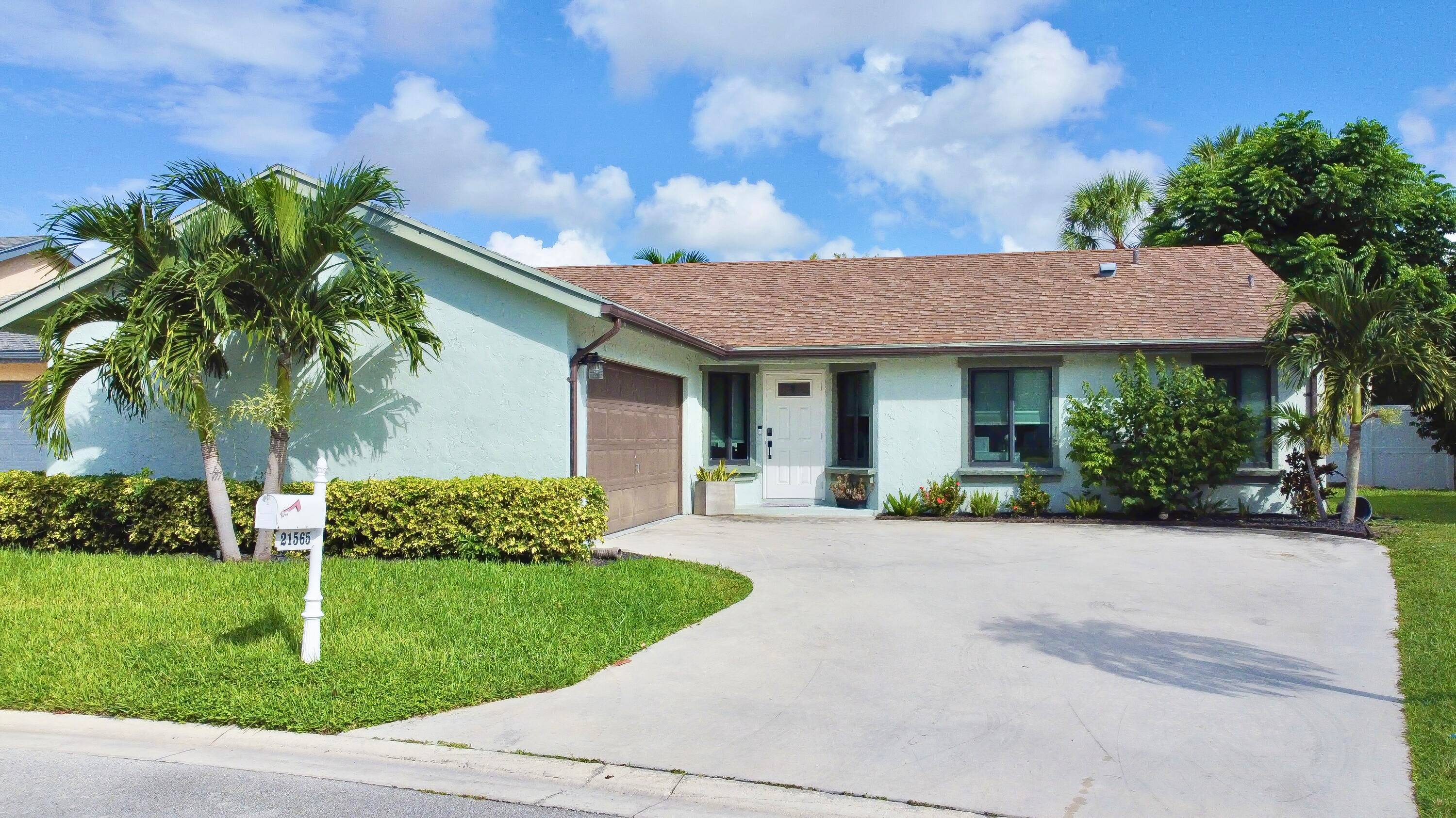 Beautiful remodeled house in west Boca, A C 2022, impact windows and doors all over the house tons of kitchen cabinets with lights inside 2 lazy susan, recessed LED lighting, ...