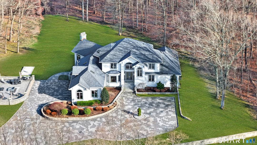 Experience the ultimate in privacy, elegance, luxury in this beautifully crafted custom Mediterranean, ideally located in the desirable White Hills section of Shelton.