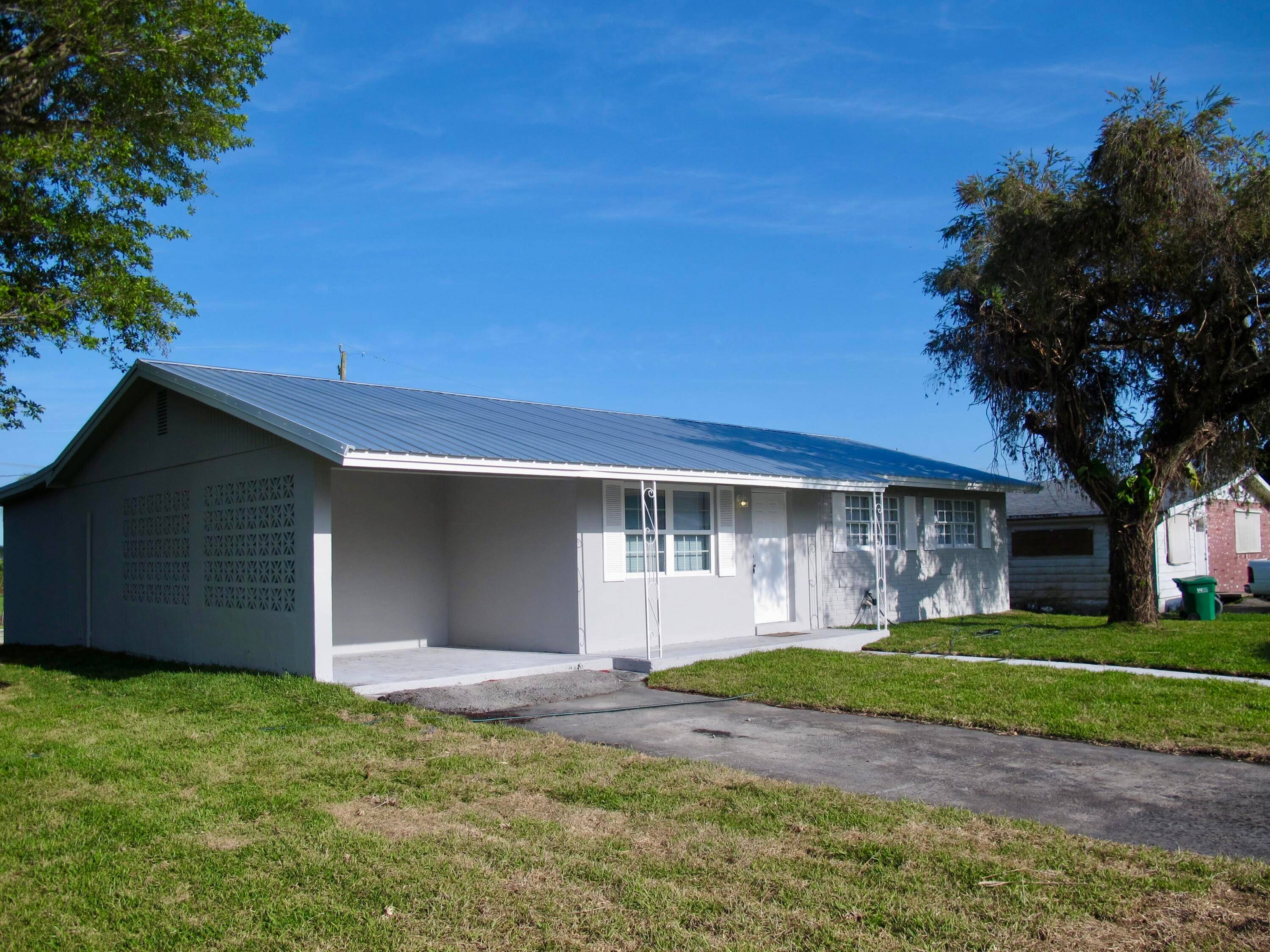 Beautifully renovated home located in the heart of Pahokee and within walking distance of Floridas historic Lake Okeechobee.