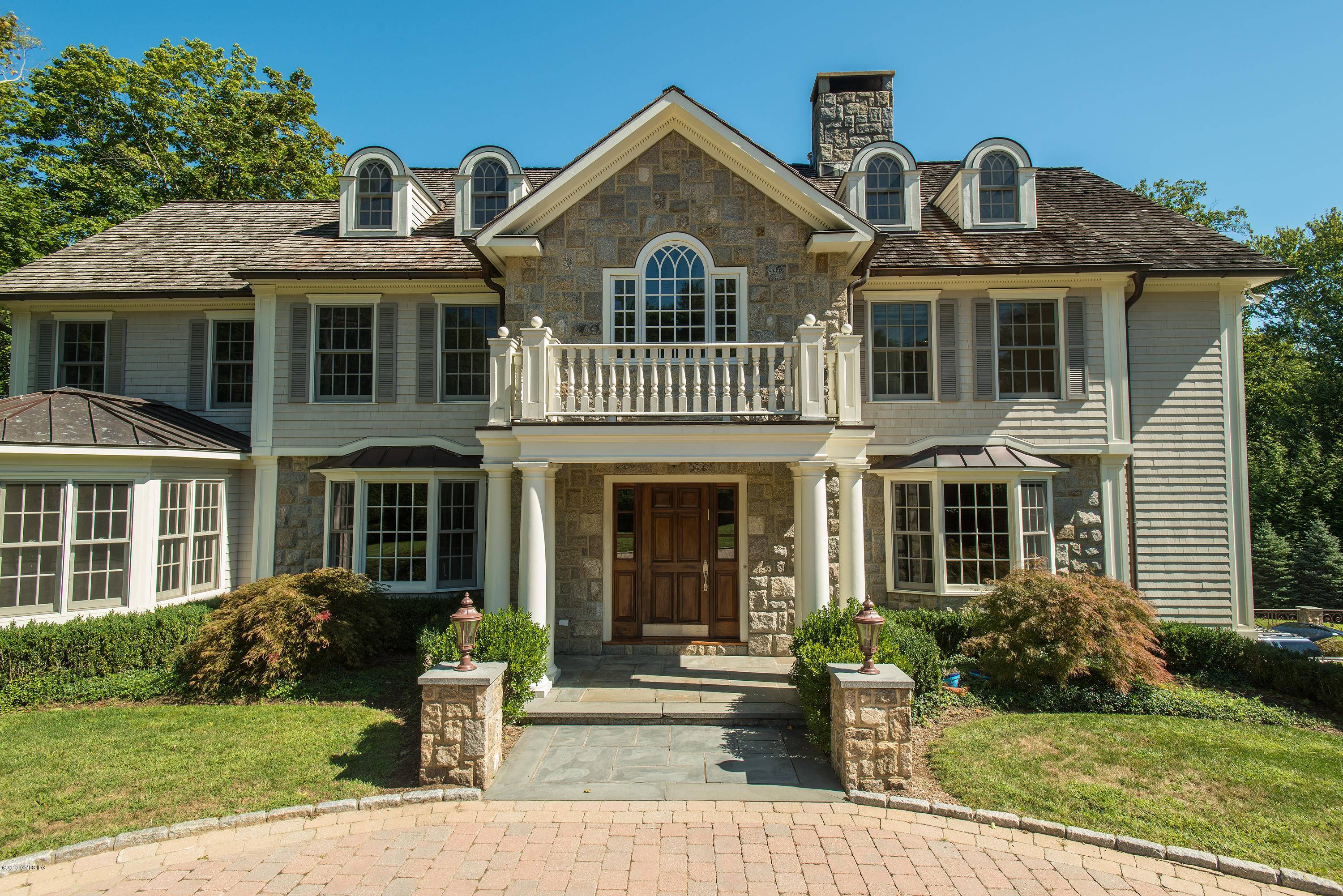 ENTER THROUGH PRIVATE GATES, SITUATED ON OVER ONE ACRE OF STUNNING, LANDSCAPED PROPERTY, SITS THIS CLASSIC STONE SHINGLE GEORGIAN COLONIAL, SUN POURS INTO THIS 5 BEDROOM, 5 FULL ONE HALF ...