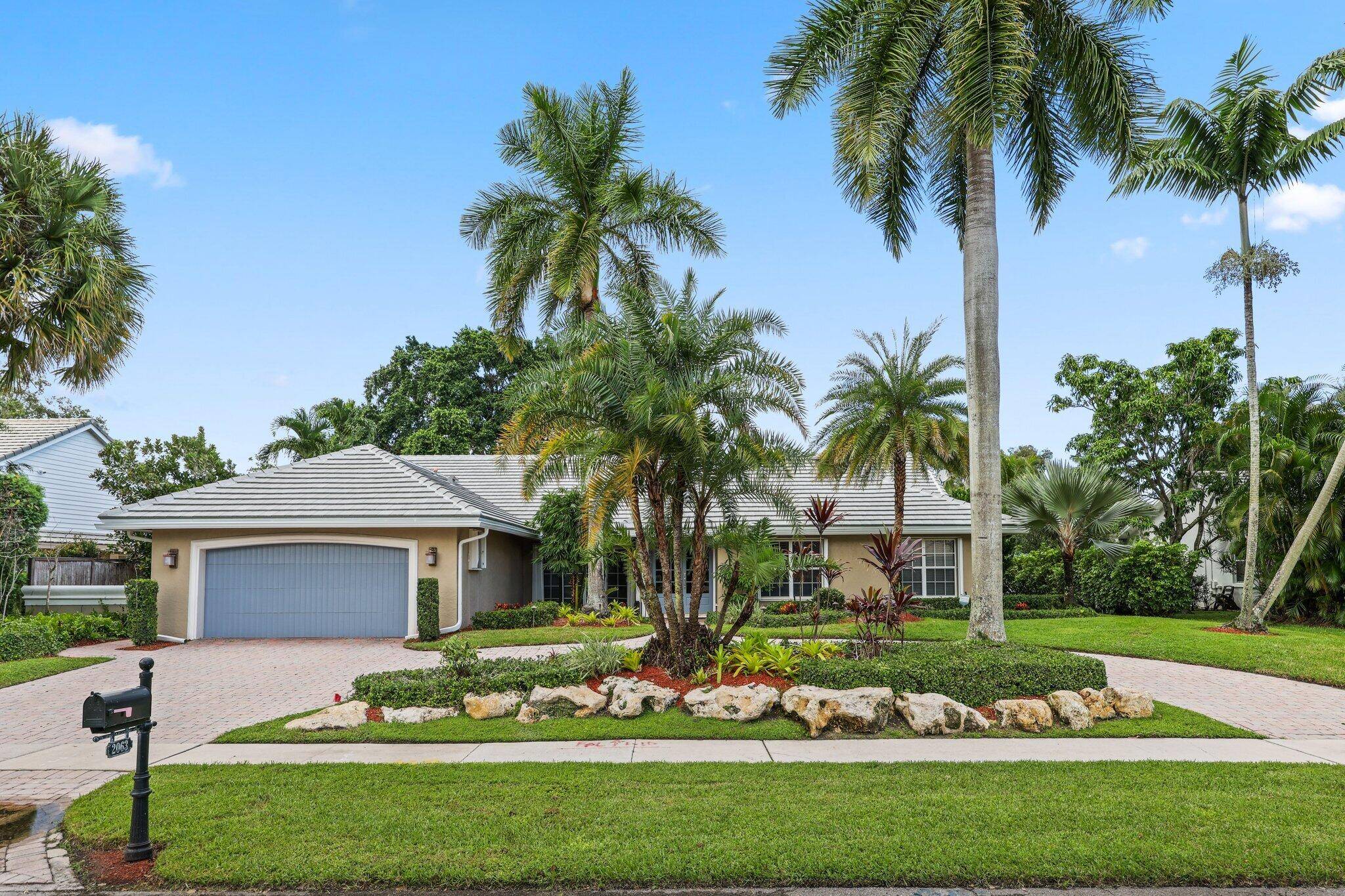 Remarkable park and lake frontage AND convenient location in Central Boca Raton.