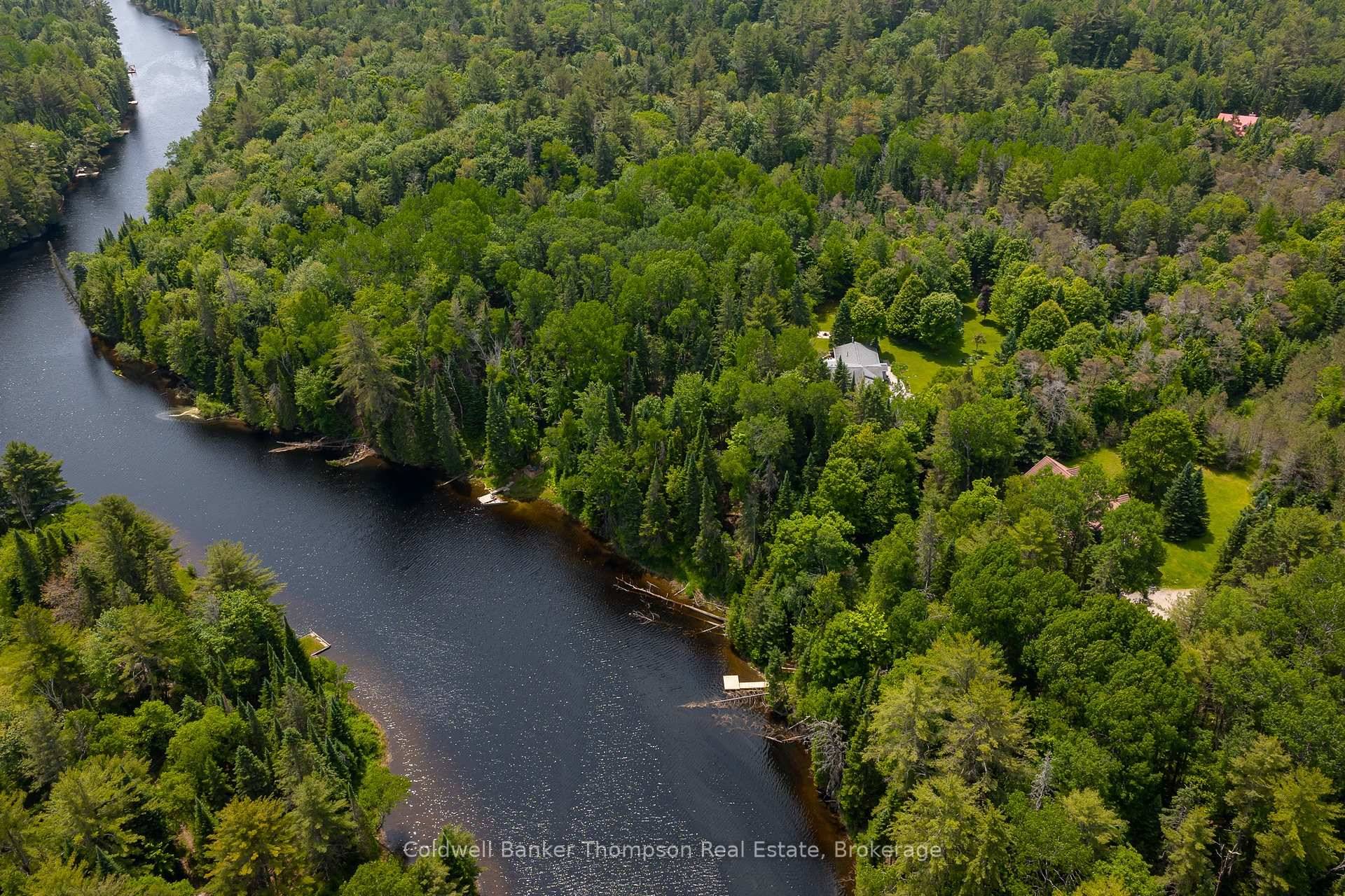 Set on nearly 4 acres with over 225ft of shoreline along the Muskoka River, this sprawling bungalow in beautiful Port Sydney is a rare amp ; remarkable offering.