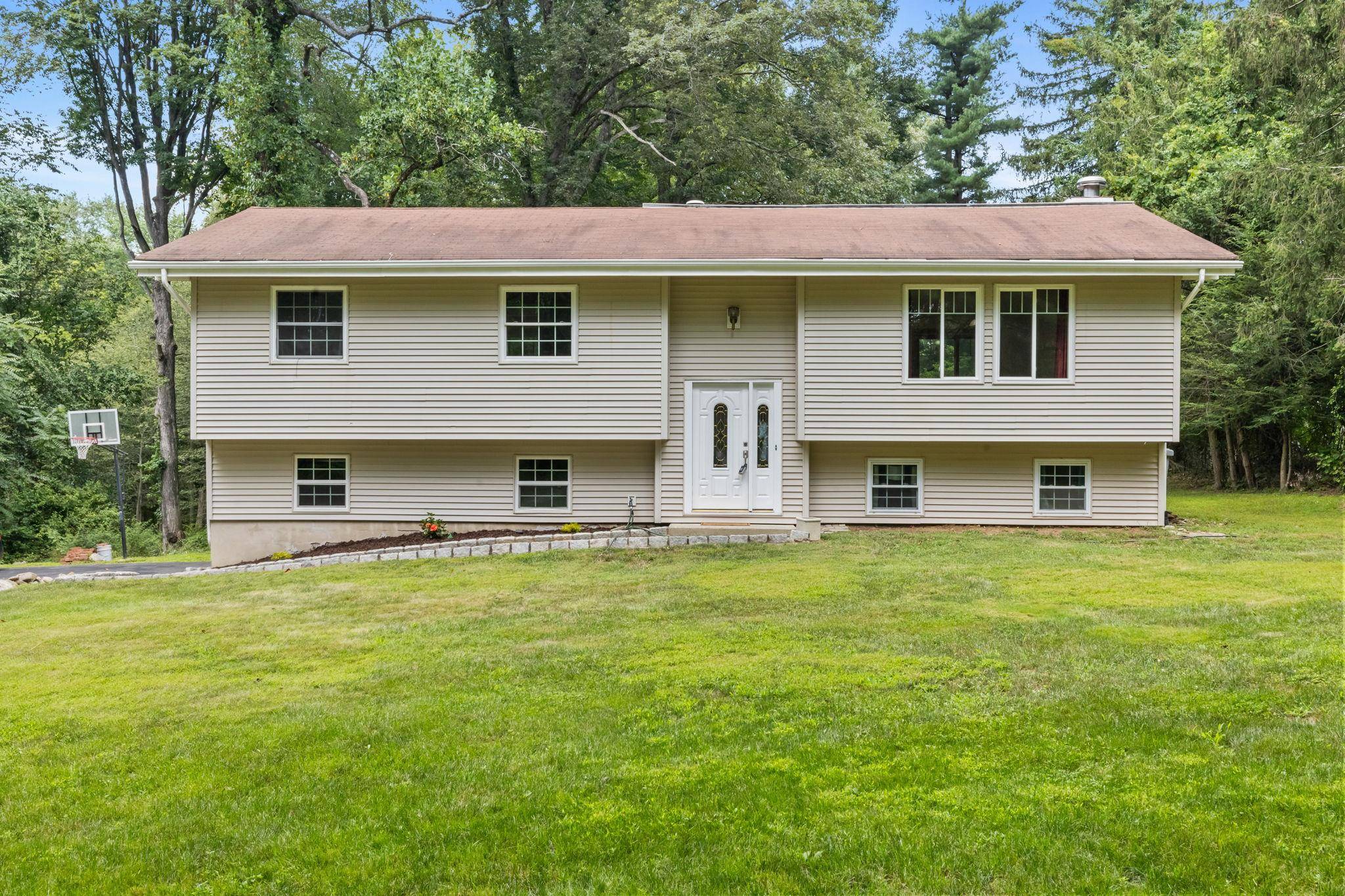 Tucked away at the end of a newly paved private drive, this inviting raised ranch offers the perfect blend of privacy, space, and modern updates.