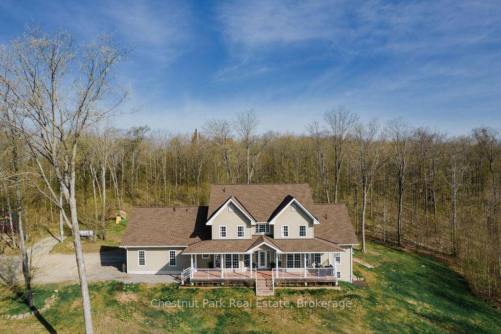 Nestled within a breathtaking 27 acre hardwood forest, this remarkable modern farmhouse offers over 4, 700 sq.