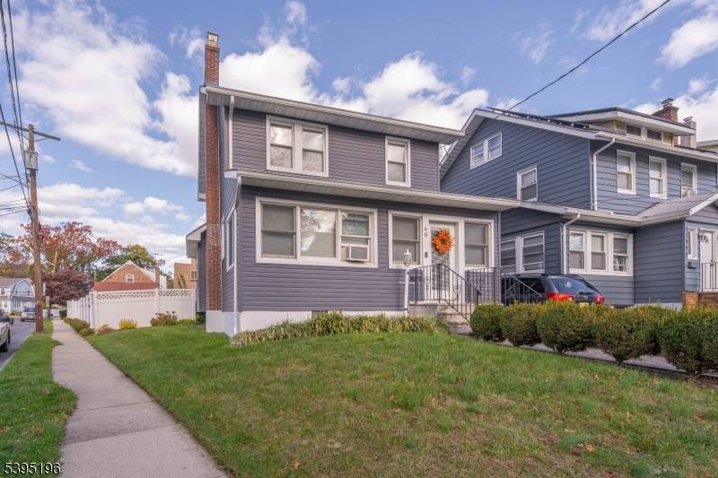 Set on a sunny corner lot, this move in ready colonial updated in 2021 welcomes you with a paver walkway and an enclosed porch.