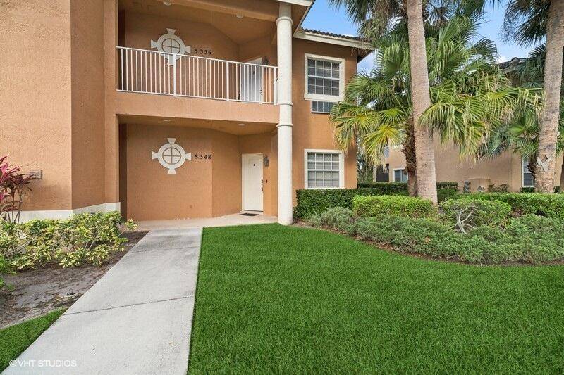 First floor corner unit with lake, golf and preserve views.