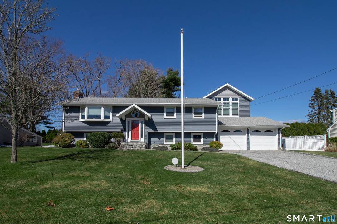 Located in the desirable Country Club Estates neighborhood, this beautifully maintained Clinton home offers private beach association access and a flexible floor plan.