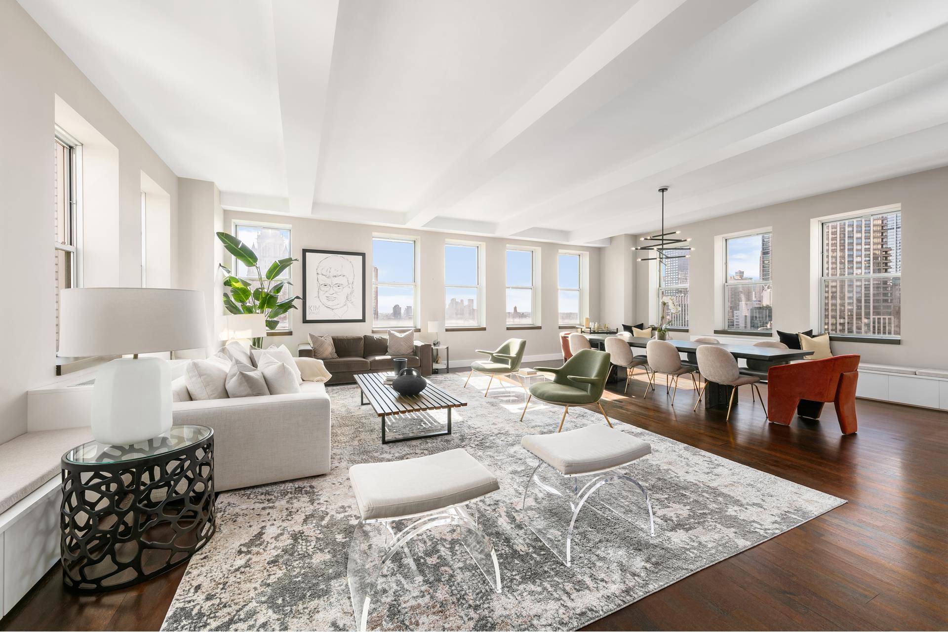 Drenched in natural light throughout the day through its 35 windows facing south, north, and east, this splendid TriBeCa loft showcases a collection of New York City's most iconic landmarks.