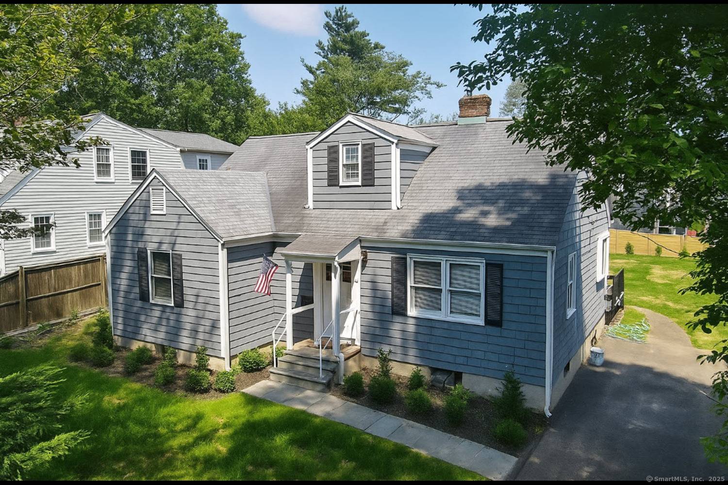 Welcome to 29 Ridgeley Street, a charming Cape Cod style home tucked away on a quiet cul de sac in the heart of Darien.