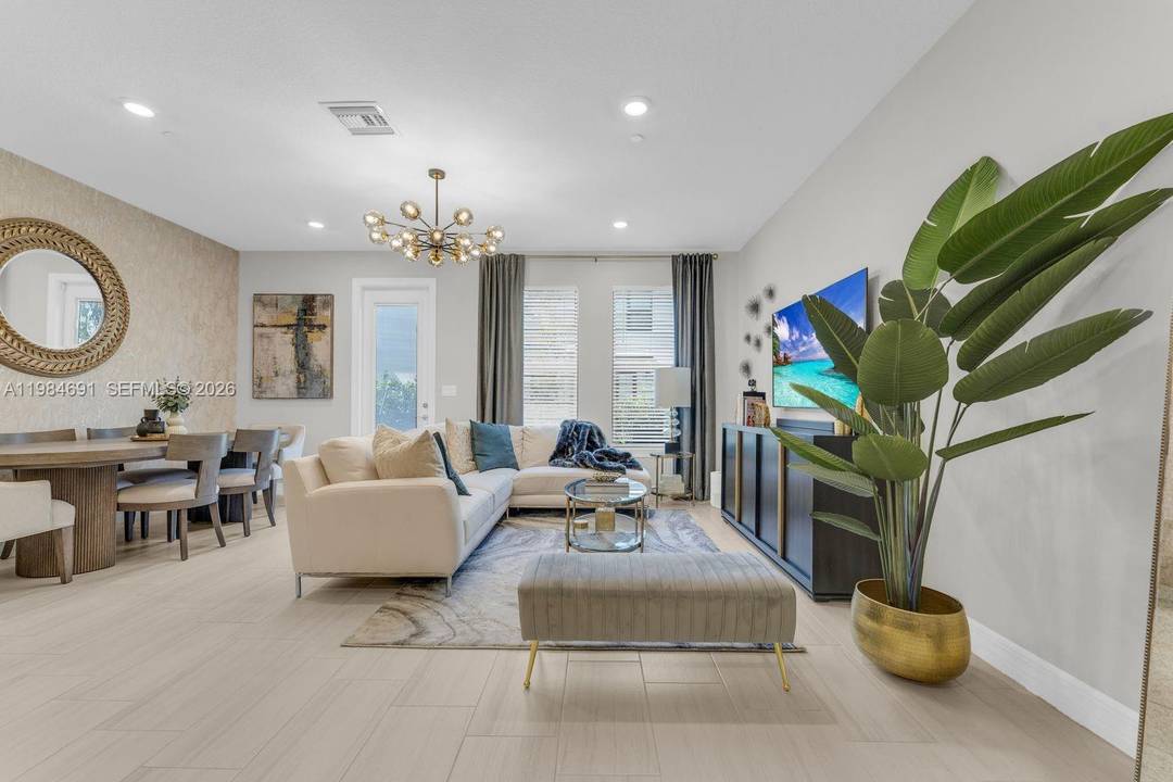 Welcome to 8351 NW 7th Ct, a newly built 2024 townhome in the gated Emory Townhomes community in Plantation.