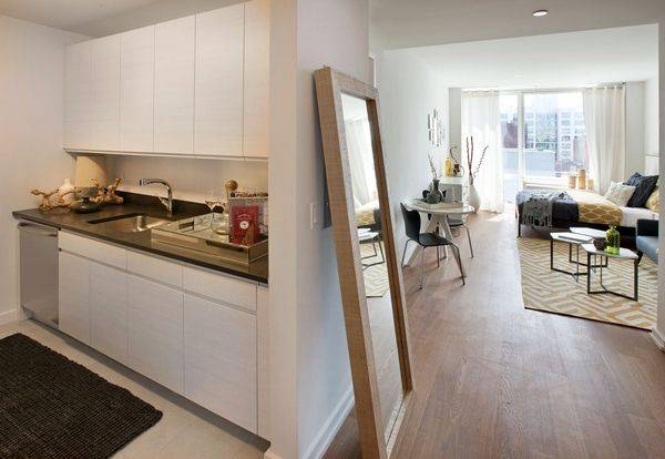 Stylish 1 bedroom with gourmet kitchen with stainless steel appliances and stone countertops and floor to ceiling windows.