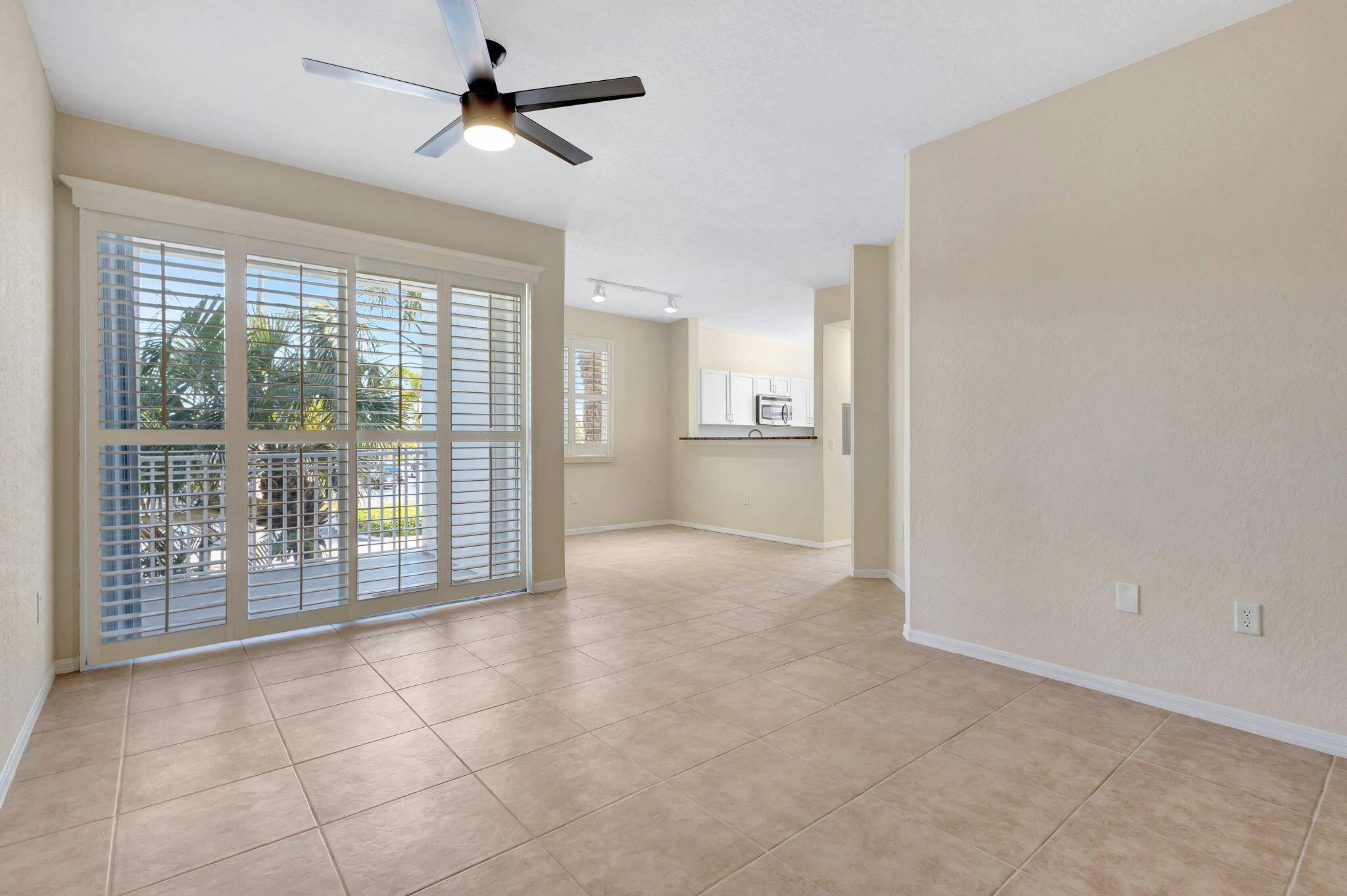 Sparkling 3 bedroom, 2 bath condo with 9 ft ceilings, two balconies, Plantation shutters throughout, all hurricane impact windows and accordion shutters for the sliding doors !