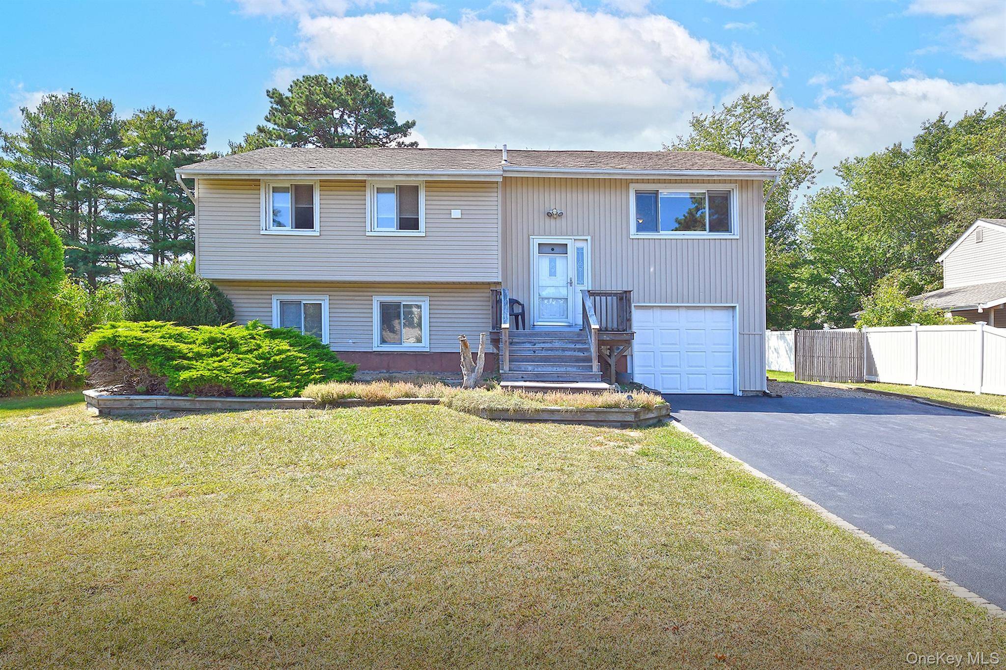 Well maintained 5 bedroom, 2 bath Hi Ranch featuring freshly painted interiors and luxury vinyl flooring throughout.