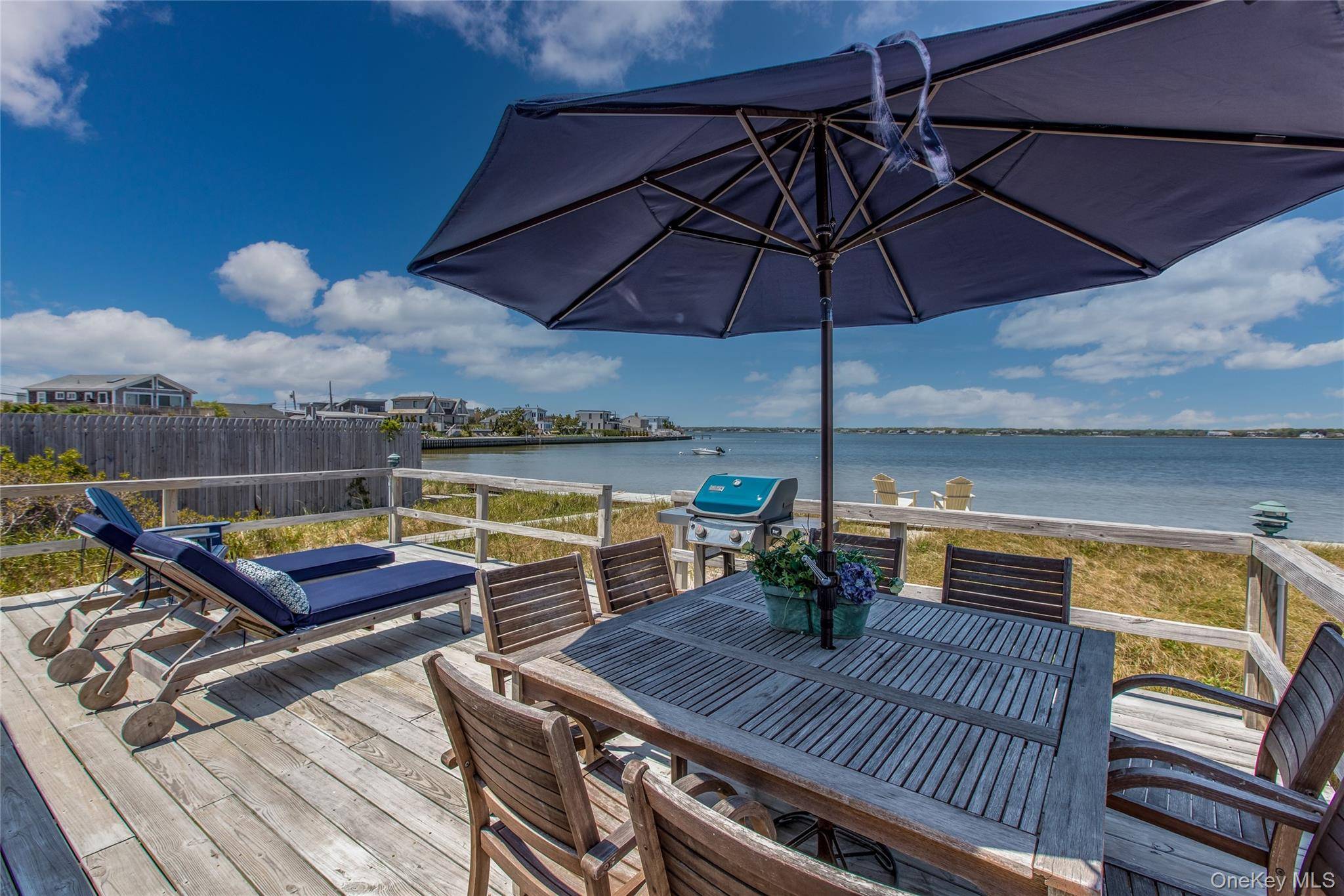 Paradise on the bay ! ! Relax and enjoy your vacation at a quintessential bayfront beach house directly across the street from one of the most beautiful ocean beaches on ...