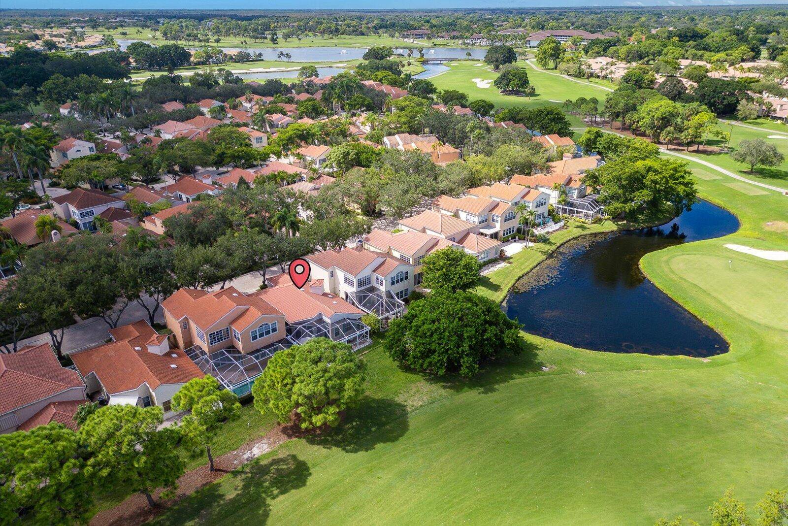 Charming single level home in the picturesque Villa D'Este neighborhood of PGA National, perfectly positioned along the 17th hole of the Fazio Course with serene lake views.