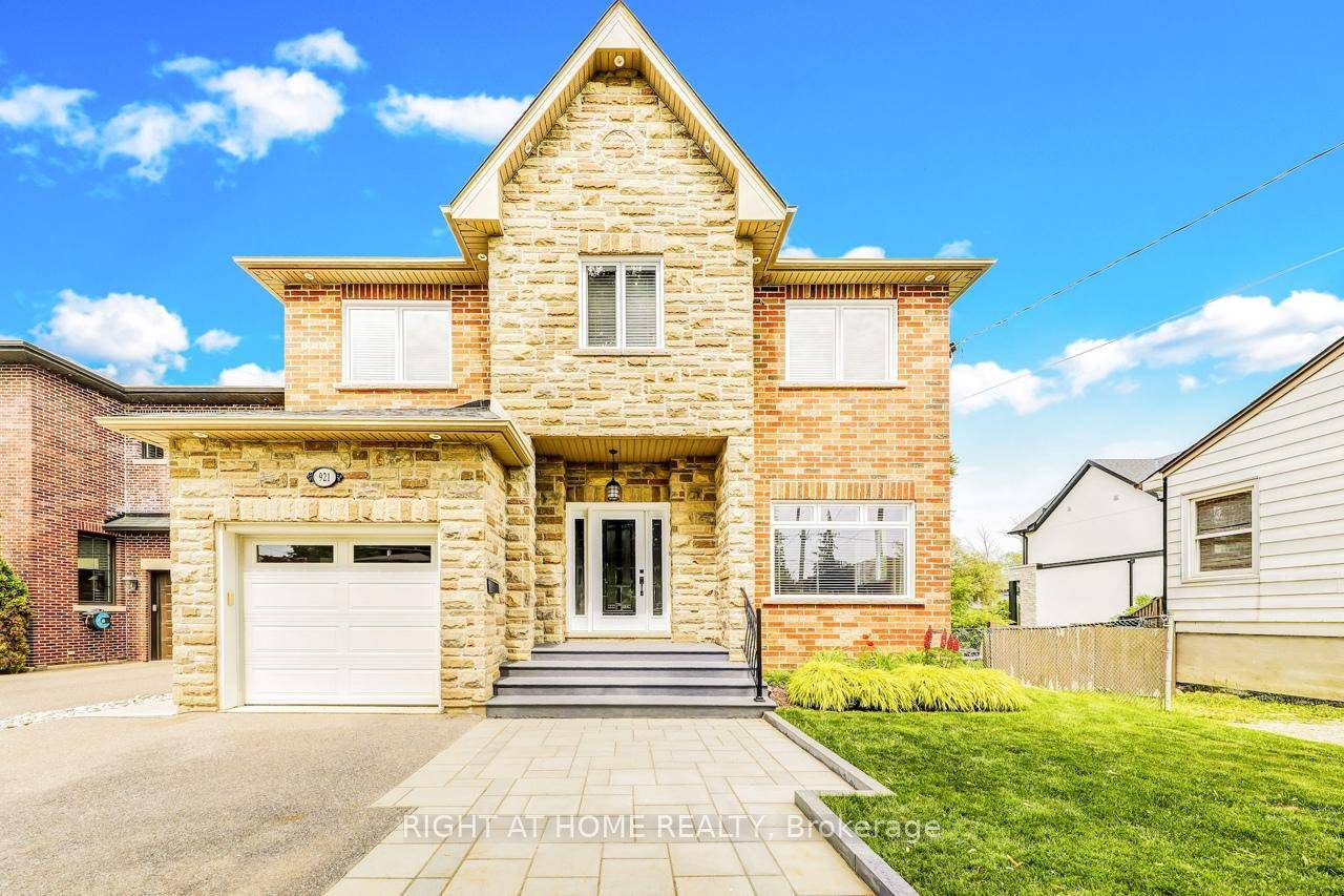 This home has a magnificent large Maple tree in the front yard and lush beautiful landscaping in the private backyard including a pond with a waterfall.