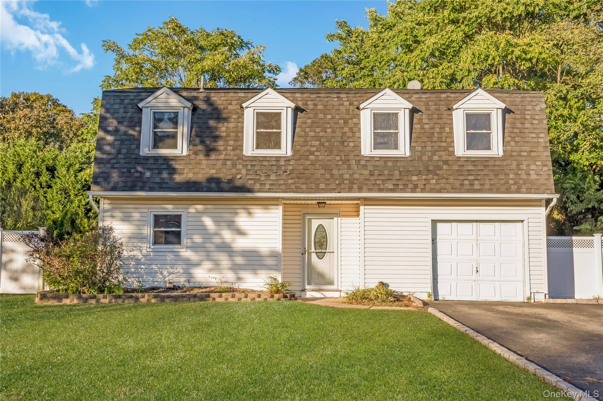 Welcome to this charming and well maintained Colonial nestled in the heart of the Sachem School District.