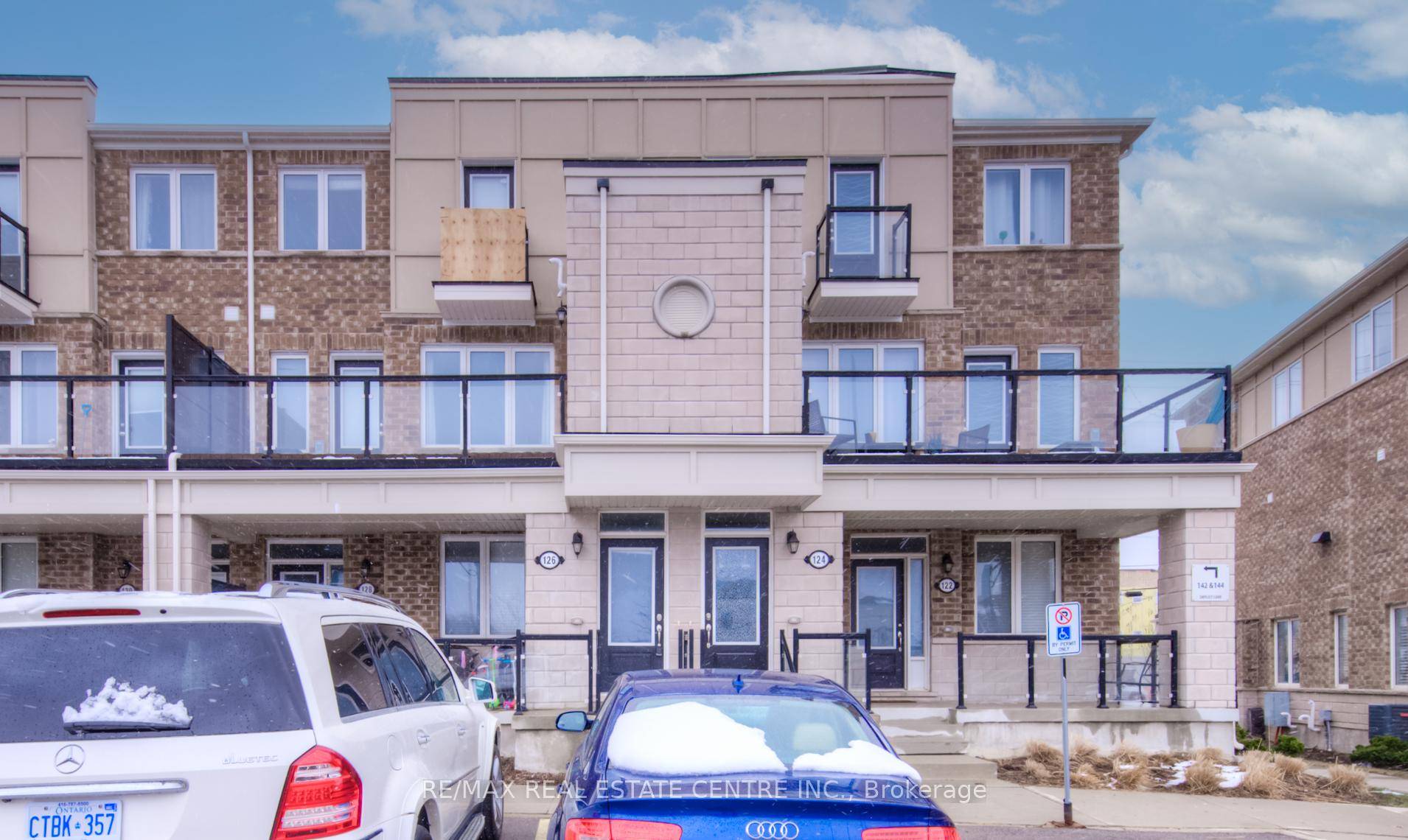 Step into this beautifully upgraded stacked townhome featuring 9' ceilings, 2 bedrooms, 2 bathrooms, 2 private balconies, and the rare bonus of 2 parking spots !