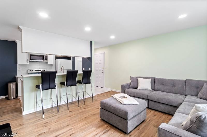 Flooded with natural light, fully updated end unit condo at Trendmaker Homes at Quailbrook 2024 renovations with no detail overlooked !