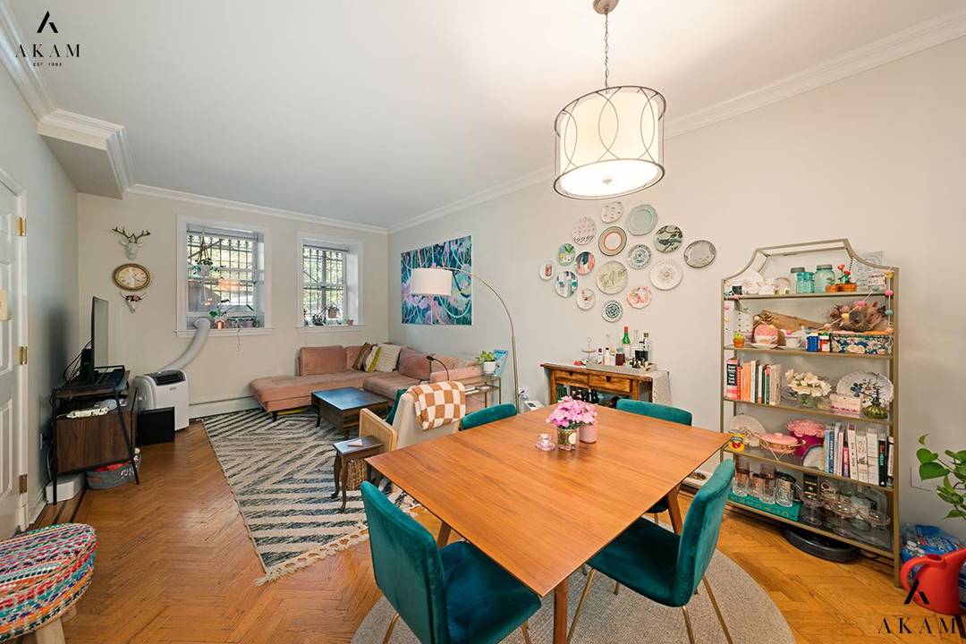 Located in a beautiful and historic, 1909 brownstone, this two bedroom, one and a half bath condominium effortlessly blends classic charm with modern comforts.