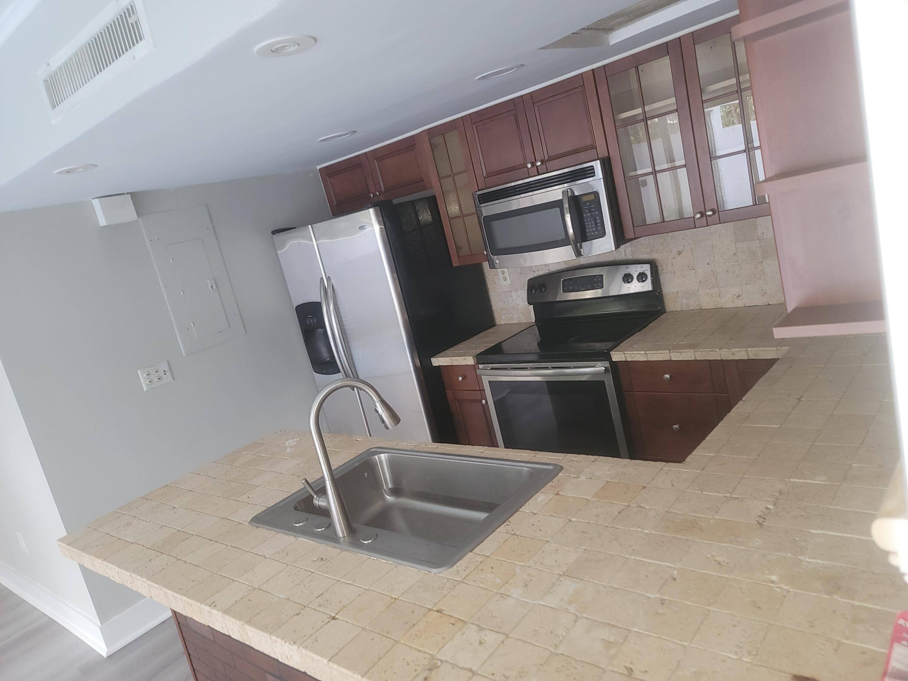 Discover the charm of this cozy one bedroom, two bathroom villa with a versatile second story loft !