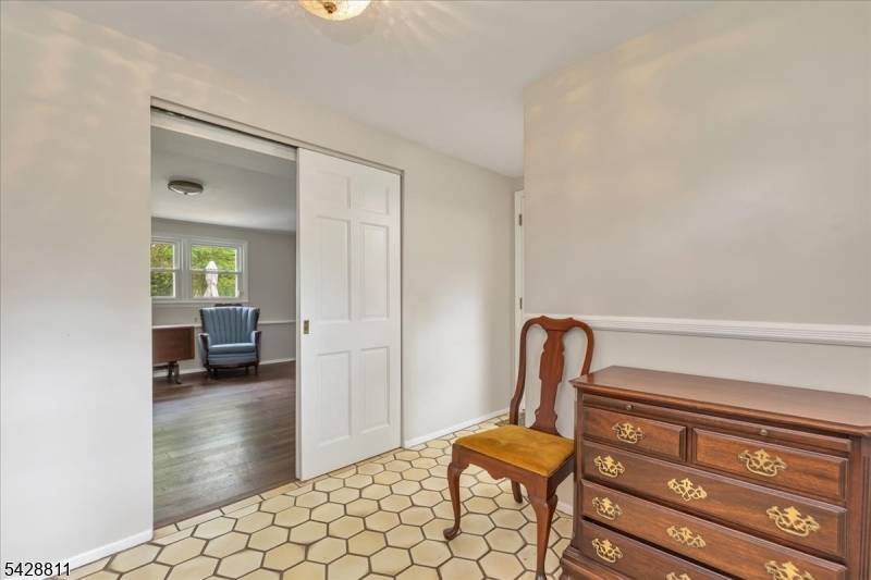 Very large ground level split with CAC, hardwood floors, Ground level gas newer powder room, den and laundry with door to patio.