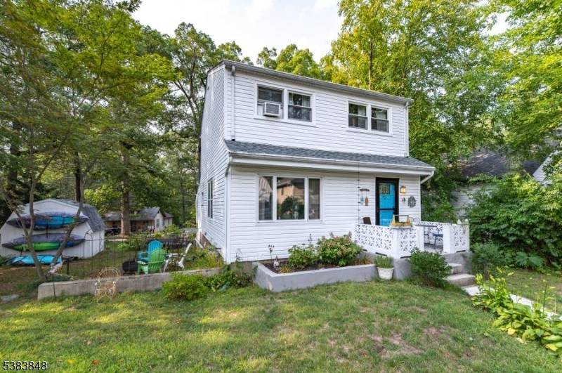 Location is everything ! This home is located less than a block from the beach in the highly sought after Erskine Lakes.