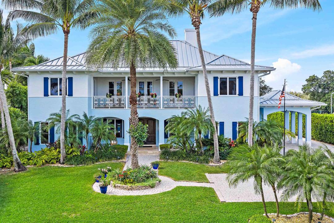 Experience year round ocean breezes in this British West Indies inspired 4 BR, 4.