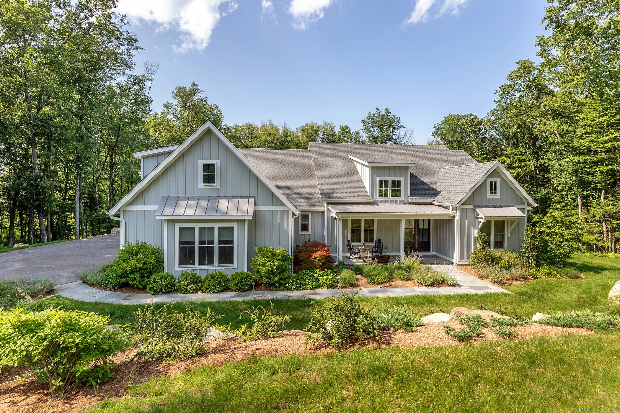 This elegant four bedroom home, built in 2021, is perfectly sited on 1.