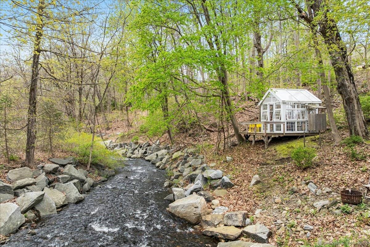Fantastic home in wonderful private setting with views of Chester Creek and sounds of the waterfall across the street.