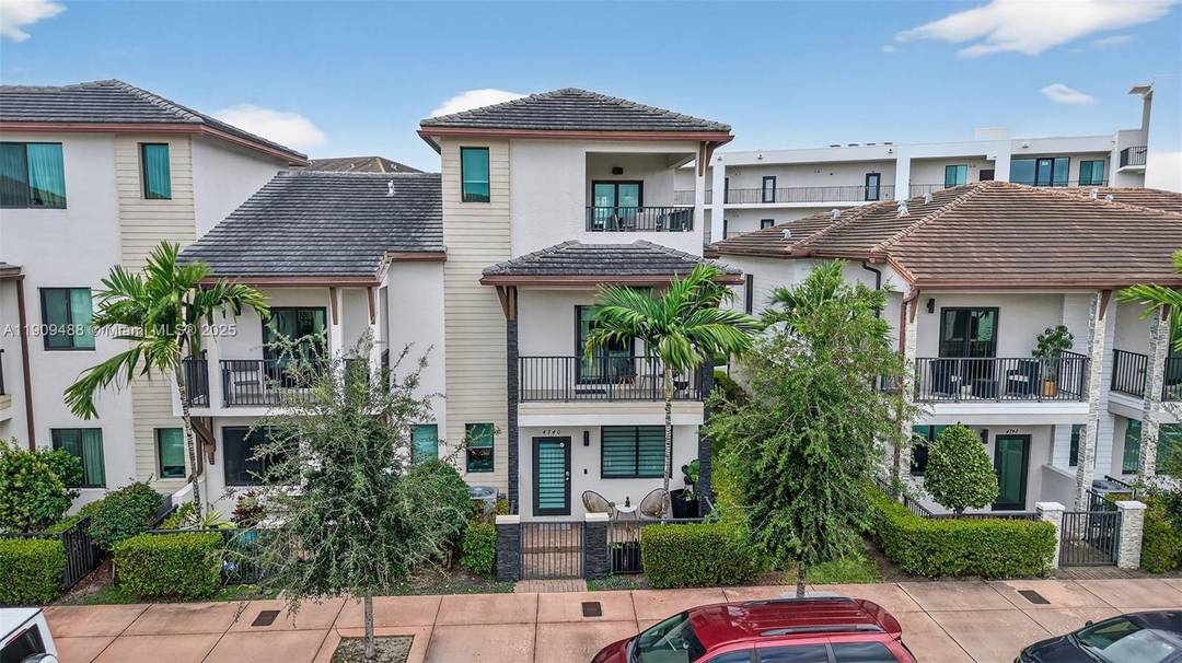 Modern 4 bed, 2 full 2 half bath luxury townhouse spanning 3 levels in the sought after community of Urbana at Downtown Doral.