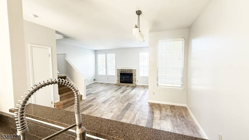 Welcome to this surprisingly sunny interior unit townhome in the desirable Wood Duck Pond enclave.