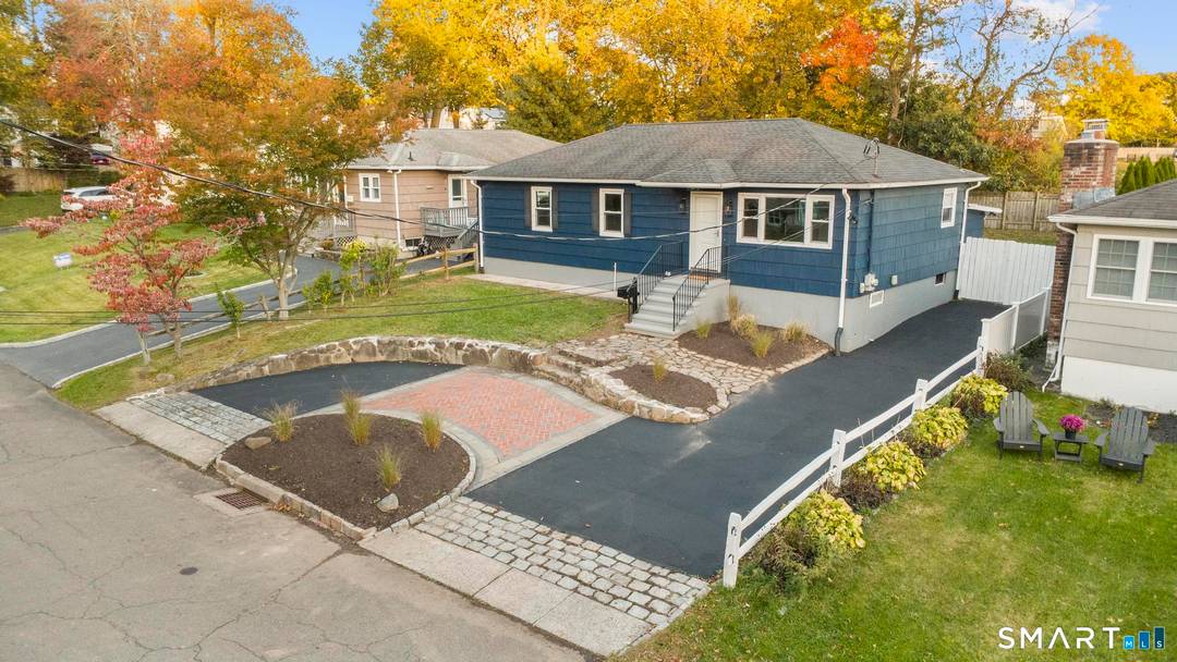 Pull into your charming half circle driveway and instantly fall in love with this home's incredible curb appeal.