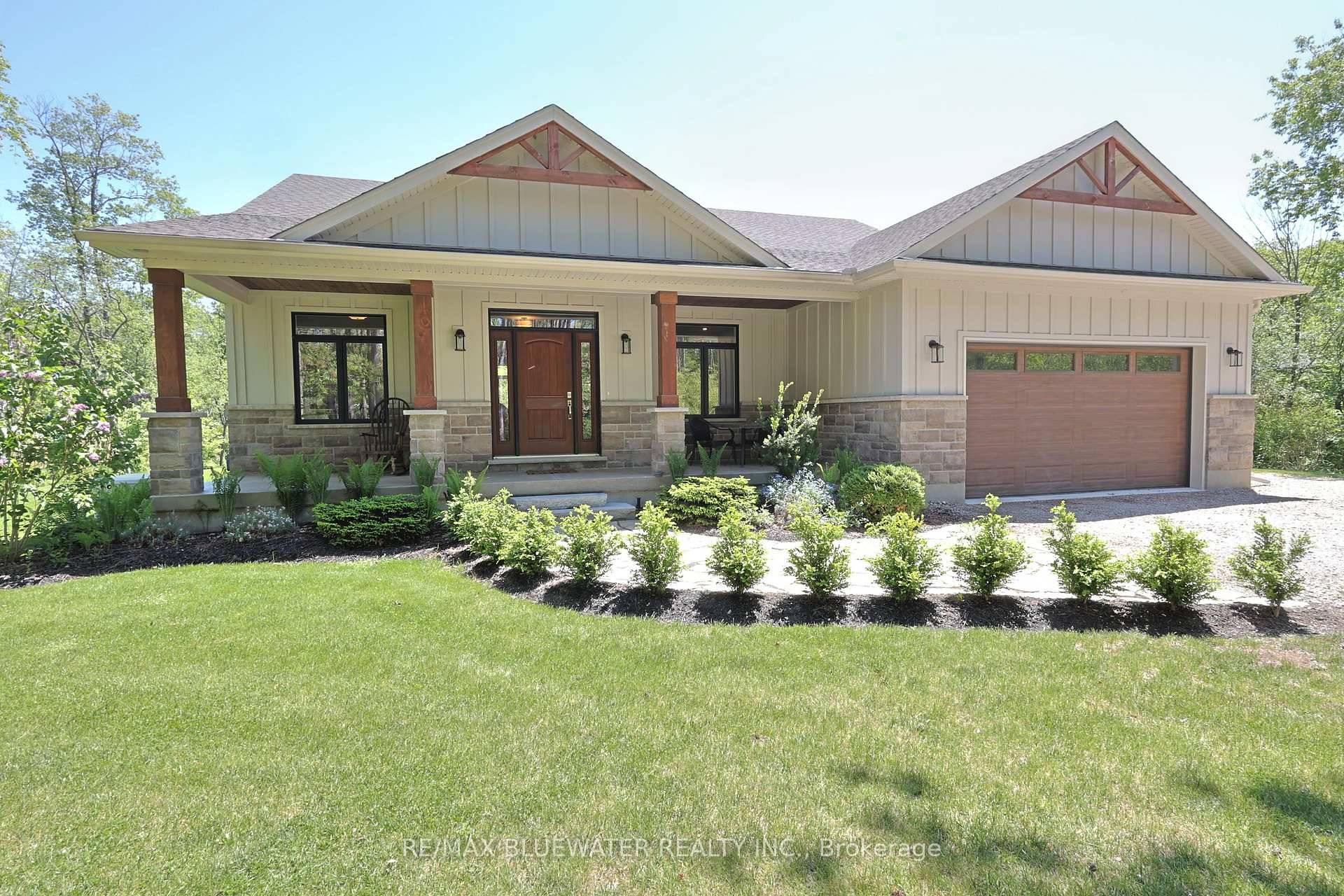 Custom built modern bungalow on a one acre lot surrounded by nature near the Pinery Provincial Park.