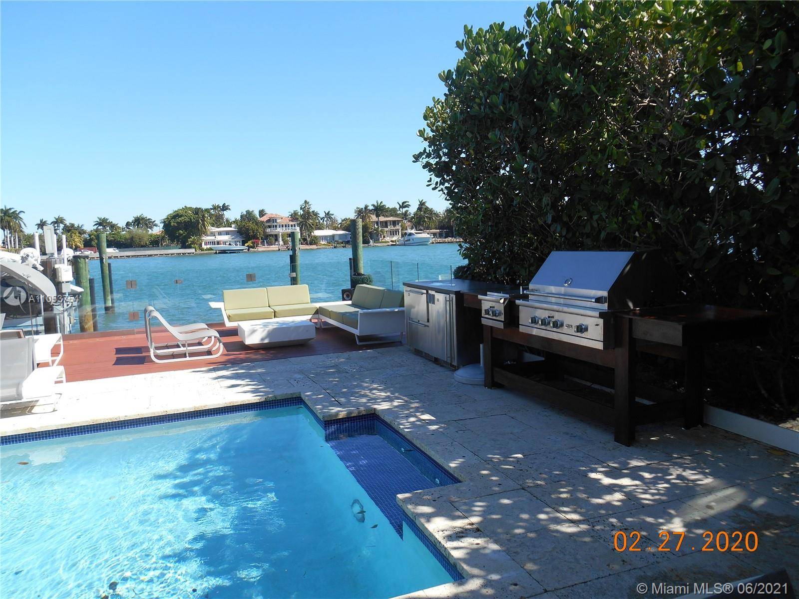 A modern bay front house in the prestigious police patrolled Palm Island.