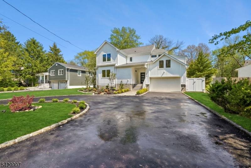 Completely rebuilt and thoughtfully expanded, this 5 bedroom, 4 bath residence offers the feel of modern design and subtle mid century influence.