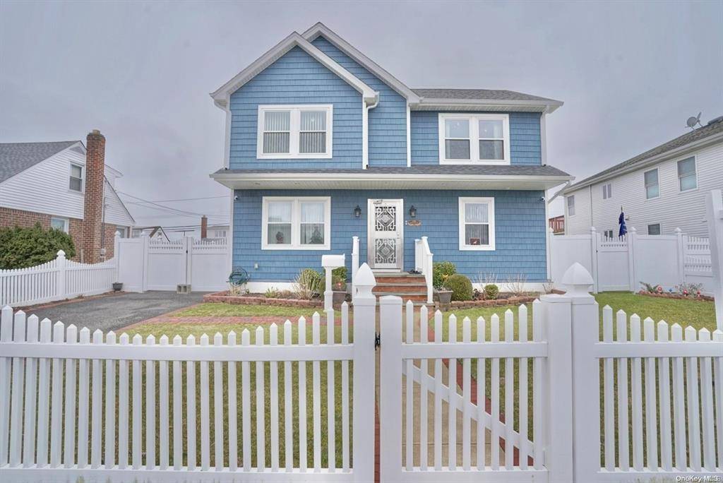 Welcome to 2382 Jefferson Street, a beautifully renovated Colonial style residence in the heart of East Meadow.