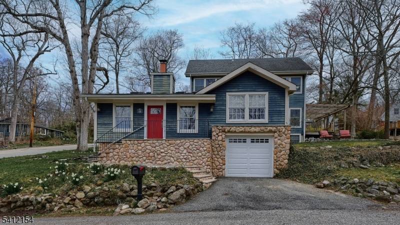 A rare blend of Pines Lake charm modern living, this custom 4 Bedroom, 2.