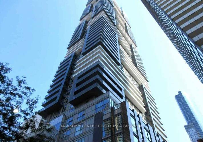 Bright and well maintained 1 Den unit featuring a modern kitchen with quartz countertops, 9' ceilings, Laminate floors, and floor to ceiling windows that open to a spacious balcony with ...